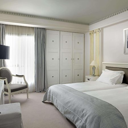 Hotel Njv Athens Plaza Pokoj fotografie A room at the Hotel de la Paix